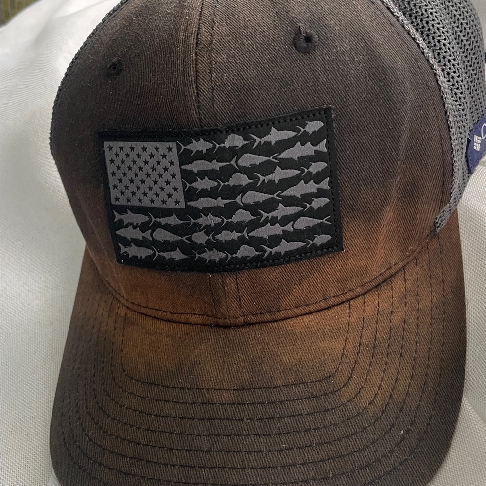 Columbia Black and Brown Fish Flag Cap rustic look.